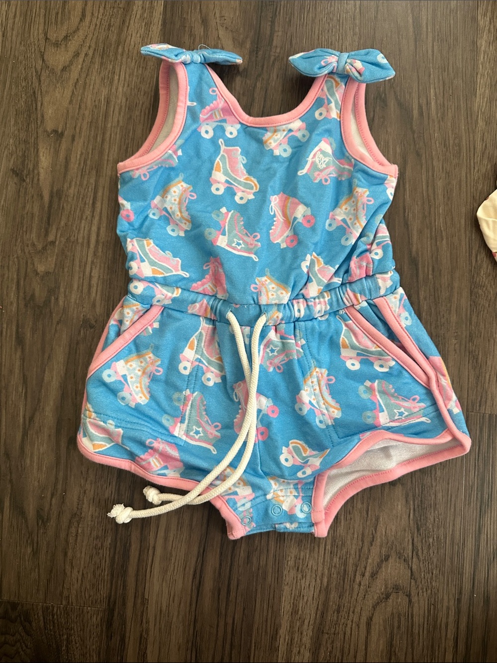 Blue Roller Skate Print Girls' Romper with Pink Trim and Tie Shoulders